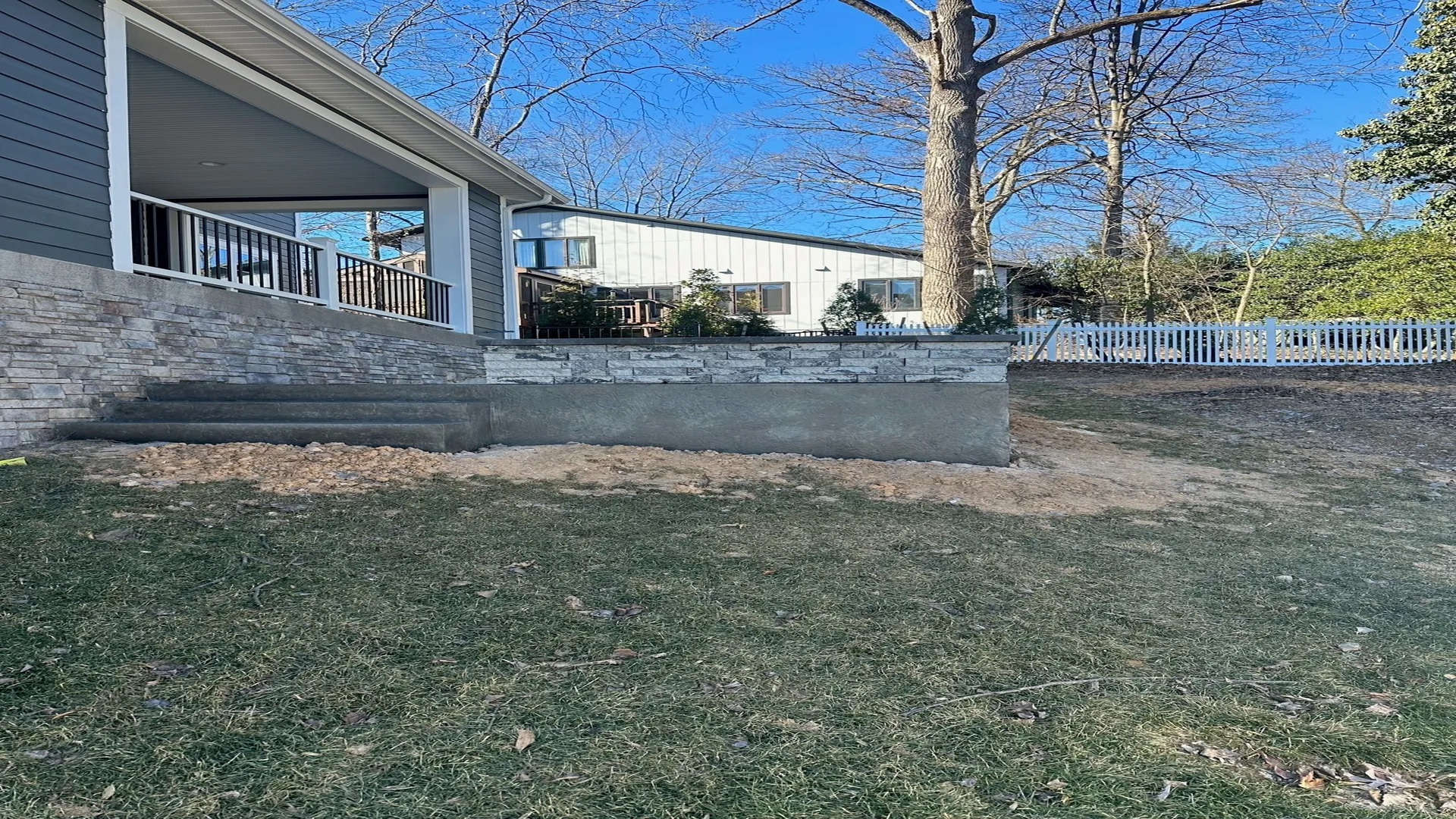 Empty yard space before planting Emerald Green Arborvitae.